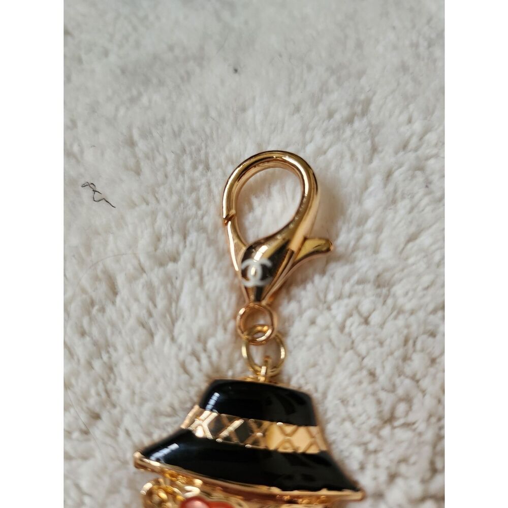 CHANEL Black and Gold Enamel Charm Doll with Pink Heart Sunglasses - Picture 3 of 7